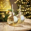 Gobelet en verre forme boule de Noël avec paille