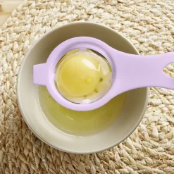 Séparateur blanc d'oeuf plastique bleu ou rose